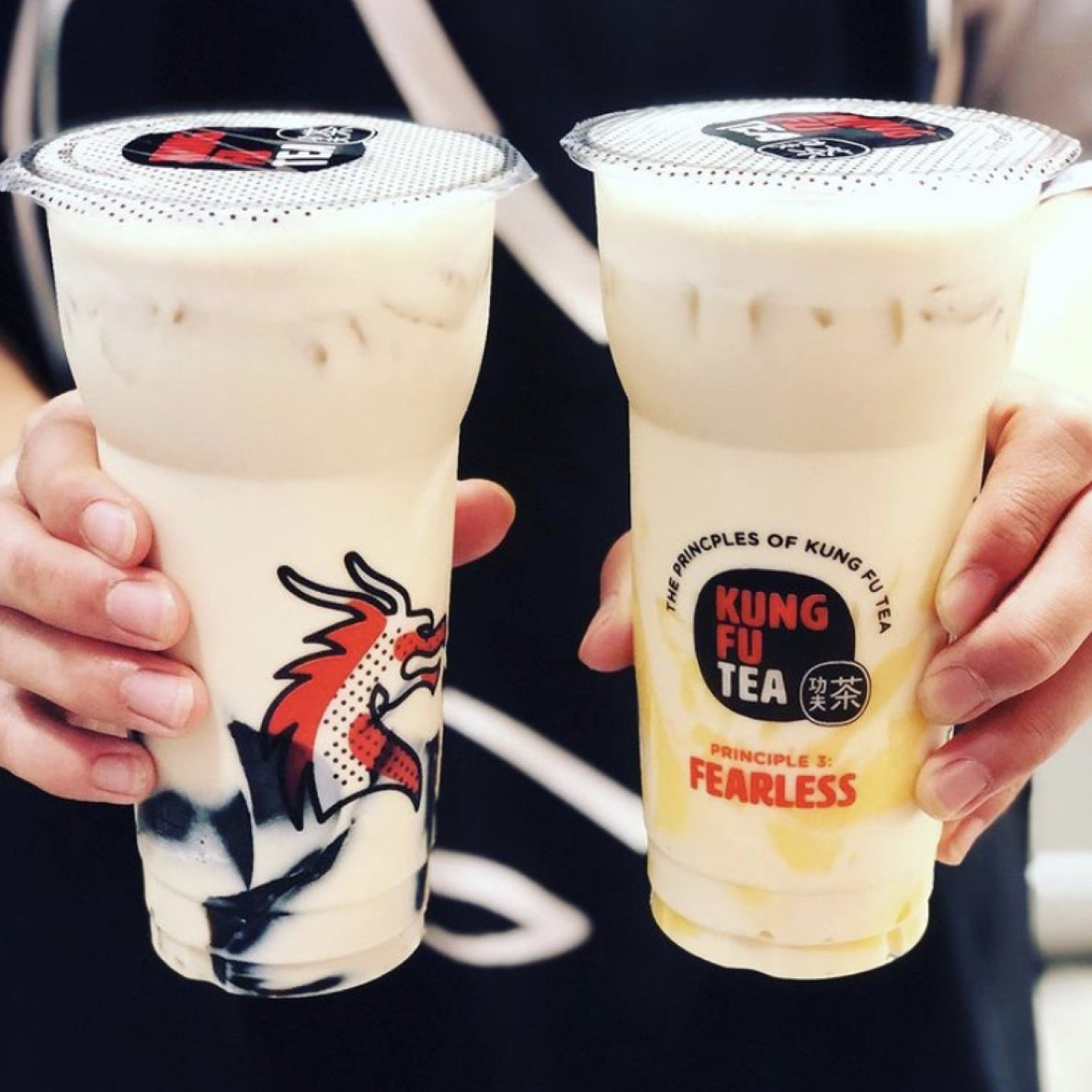 Two friends each holding a Kung Fu Tea milk tea, part of the brand's Fearless campaign